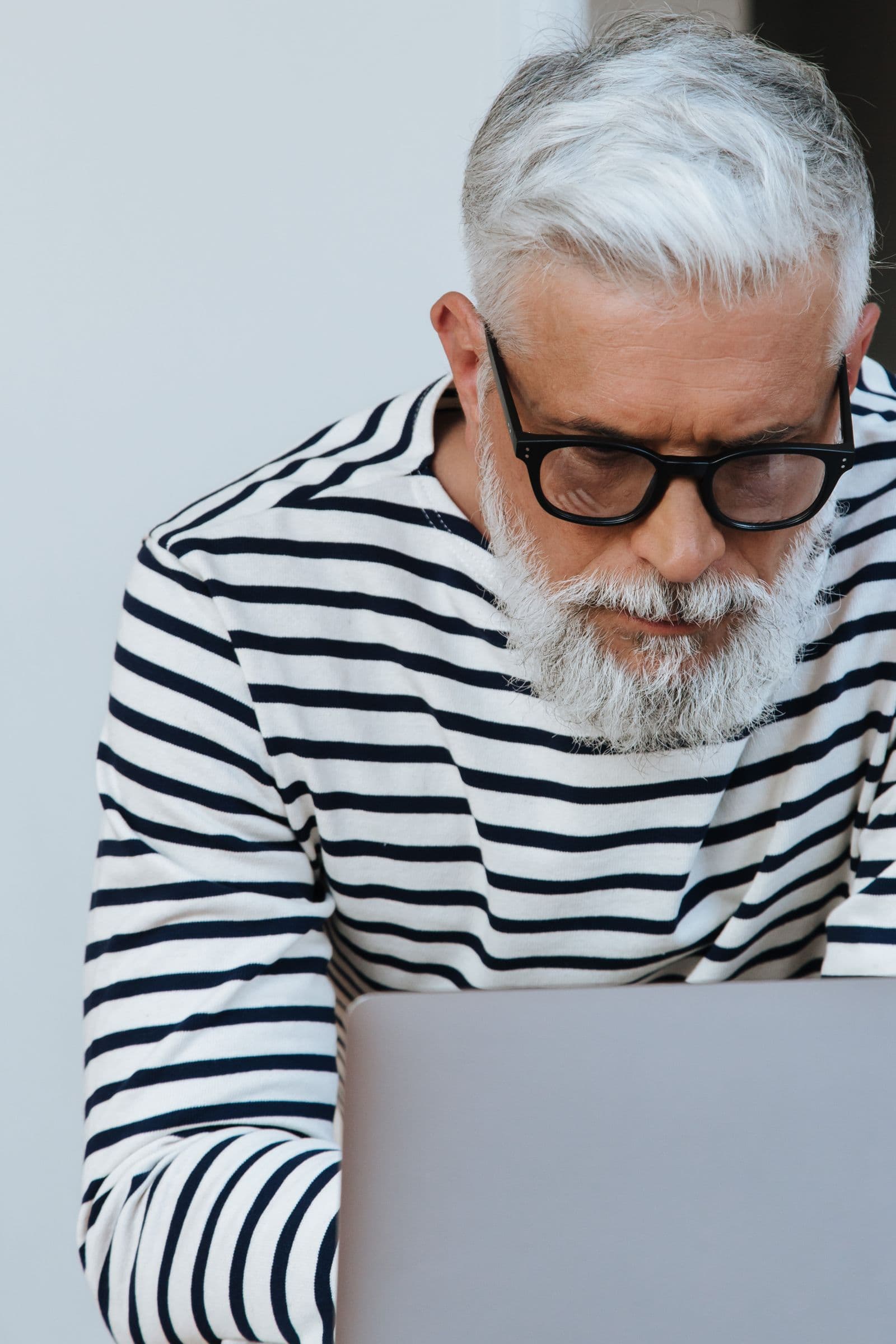 A man at home working on his laptop